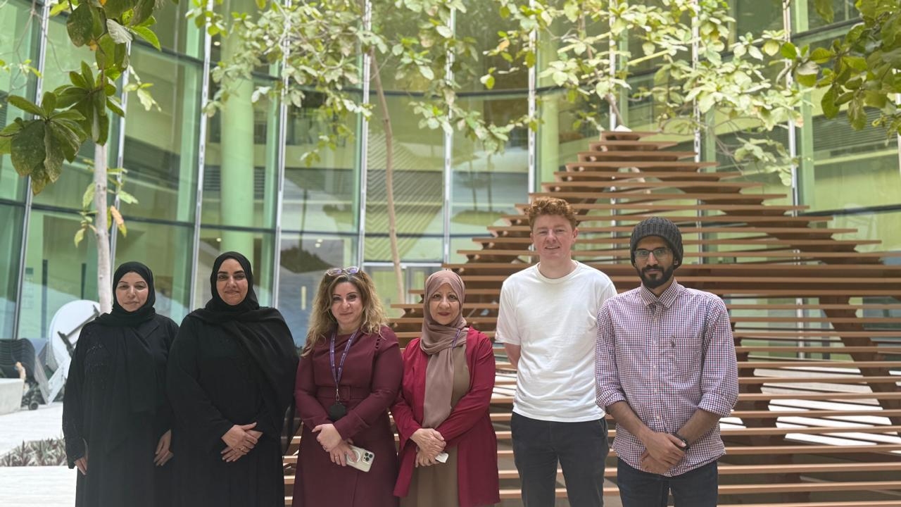 Organizing team and supervisors at the NYUAD atrium staircase